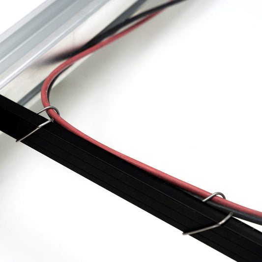 2 CableFixPro clips on frame holding a cable