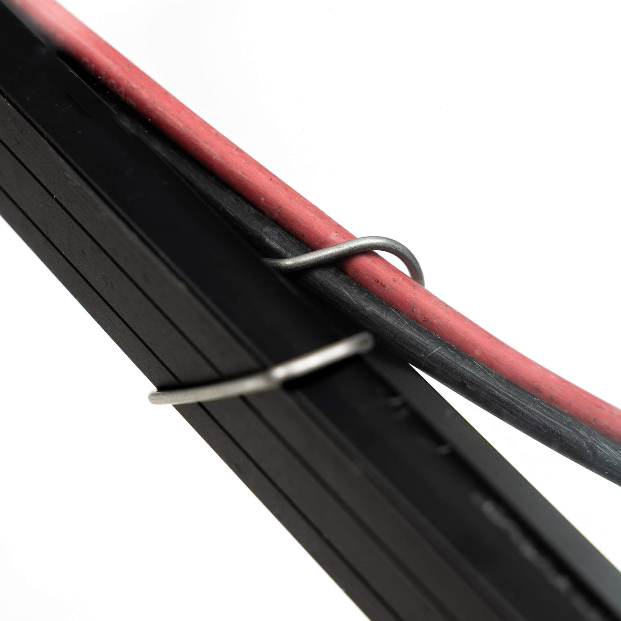 CableFixPro close up on frame and holding a wire