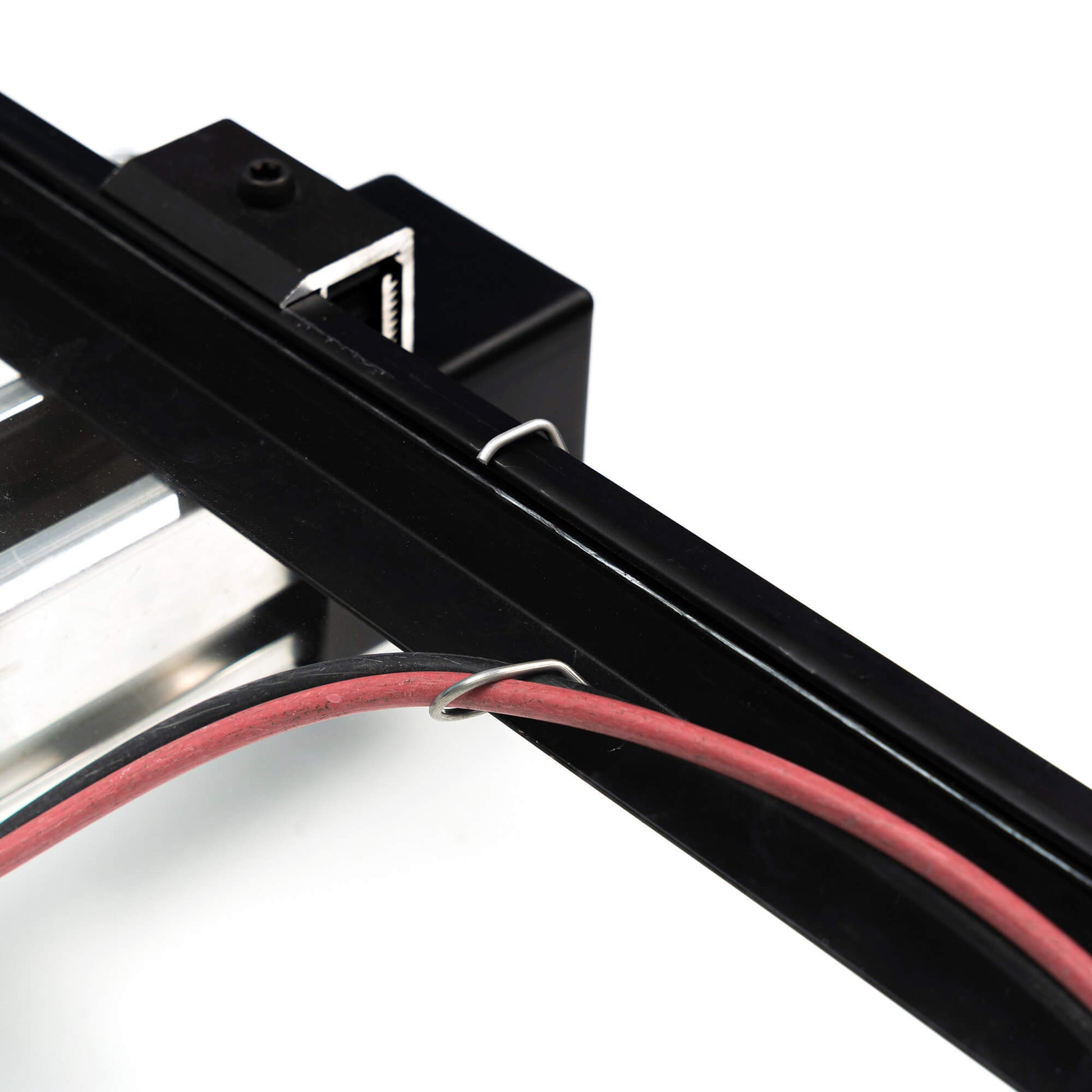 CableFixPro on frame and holding a cable